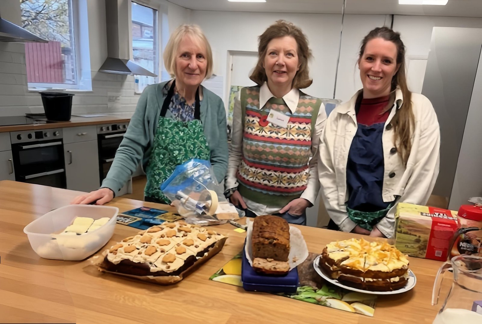 Cafe team with cakes